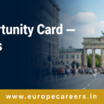 Professional web banner showing a confident South Asian man in formal attire holding documents in front of a blurred German city street. Bold white text reads “Germany Opportunity Card — Your 12 Months to Find a Job” with a dark navy overlay and gold footer displaying www.europecareers.in