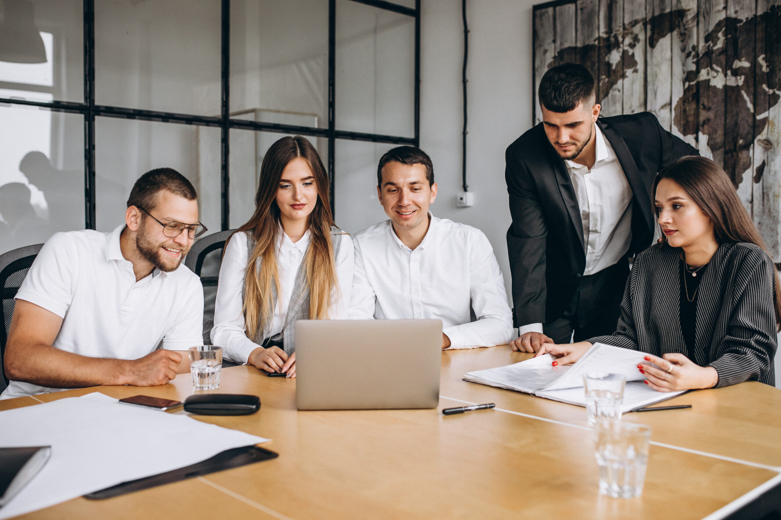 Colleagues collaborating on project planning in a modern office meeting